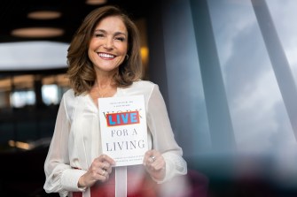 Paula Caligiuri posing with her book.