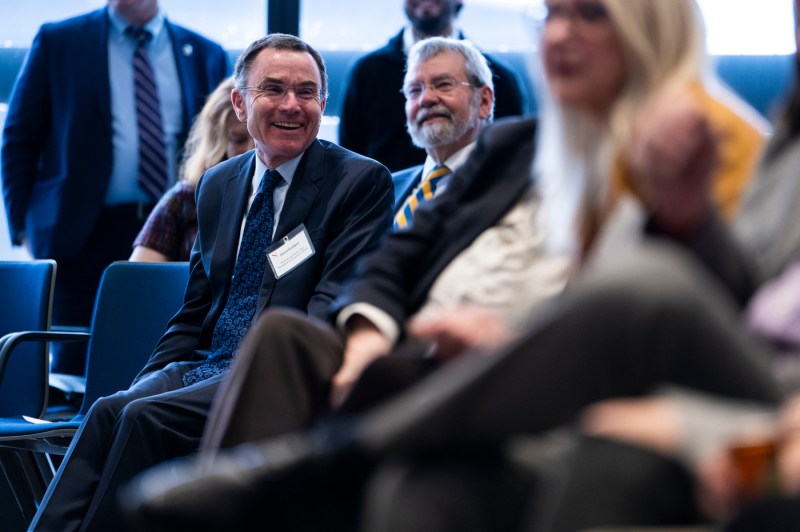 David Madigan and another audience member smile and laugh together.