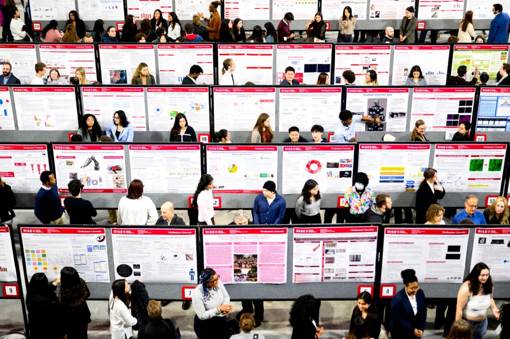 Rows of students presenting posters at the 2024 RISE Expo.