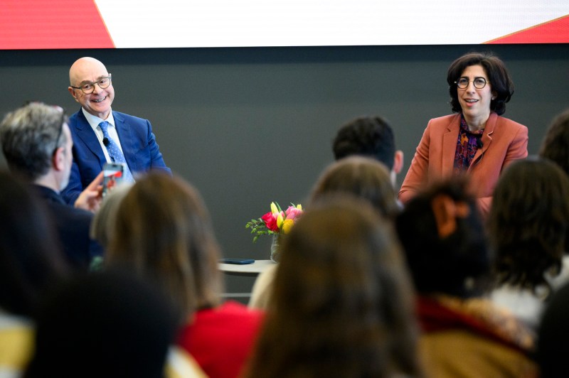 Rima Abdul Malak and President Joseph E Aoun sitting on stage smiling.