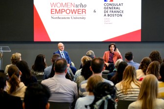 President Joseph E Aoun and Rima Abdul Malak on stage.