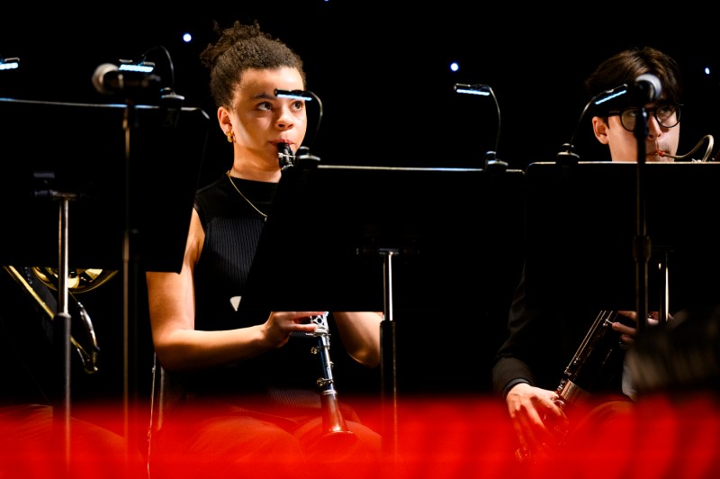 Members of a band playing at Blackman auditorium. 