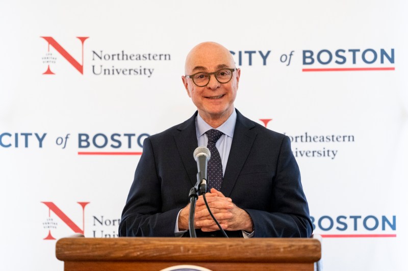 President Joseph Aoun poses for. a photo at the Moakley scholarship reception.