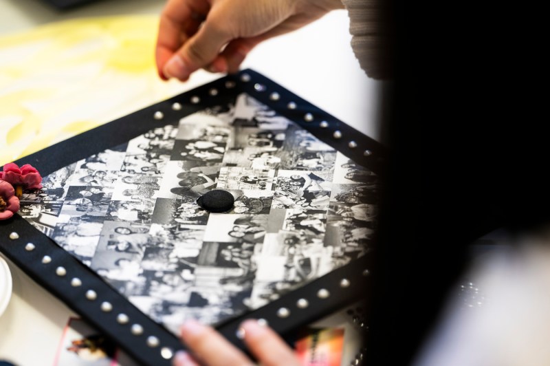 Student decorating their graduation cap.