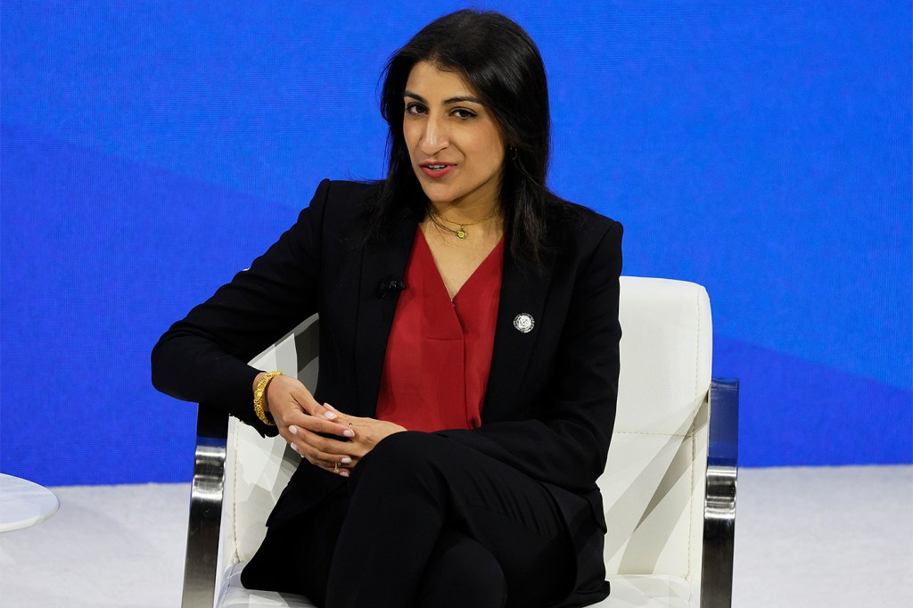 Lina Khan sitting in a chair speaking.