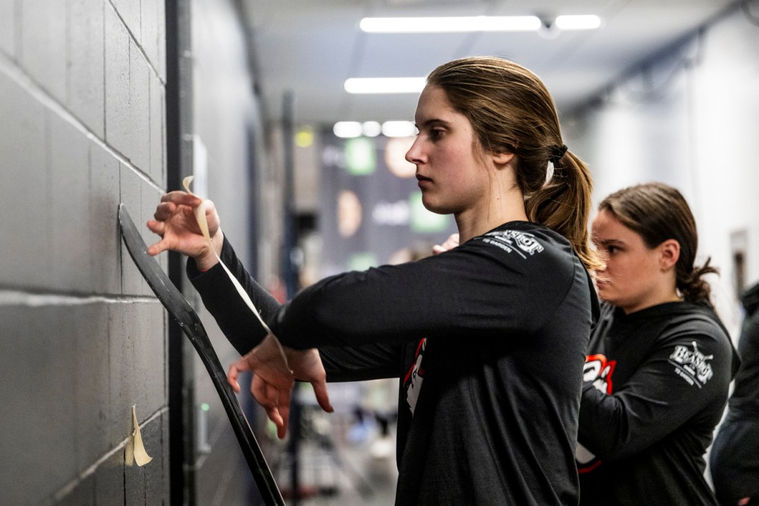 Megan Carter taping her skates.