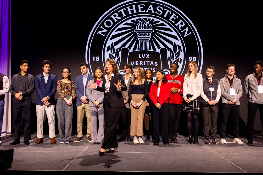 Diane Nishigaya MacGillivray on stage at the Experience Powered by Northeastern event.