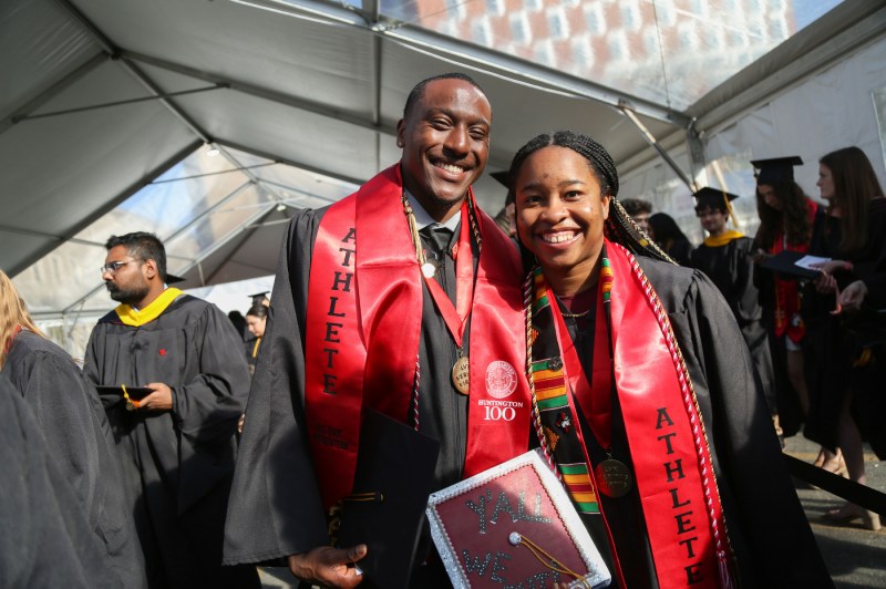 Graduates smiling at the Bouve commenement ceremony.