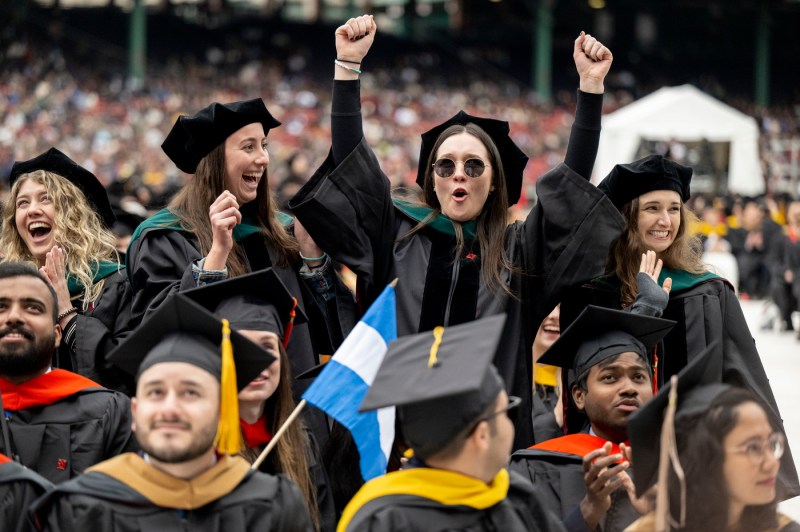 Students cheering at Fenway Park. 