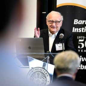 Barry L. Karger gesturing while speaking at the Barnett Insitute 50th Anniversary.
