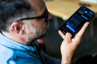 A person recording a voice memo on their phone.