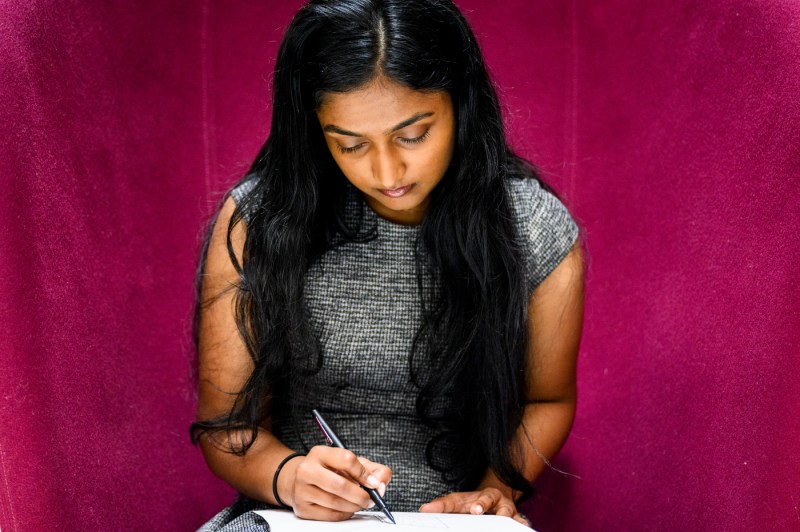 Rikita Iyer drawing an architectural mock up.