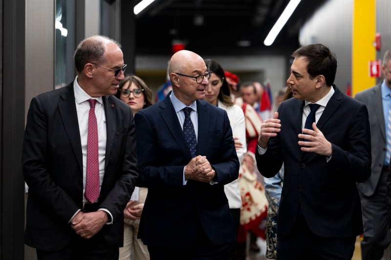 President Aoun walking with Christian de Sanzo and another person.