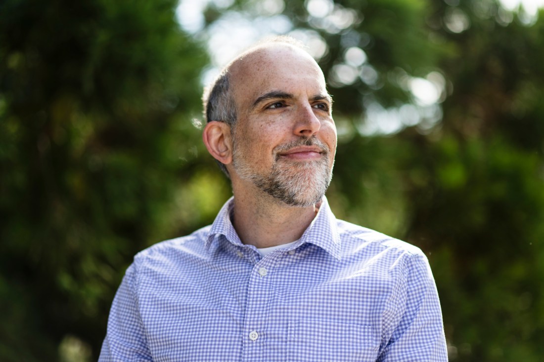 Headshot of Adam Cooper. 