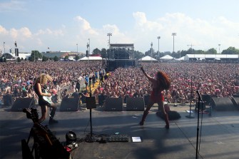 Chappell Roan dancing and singing on stage at Boston Calling.