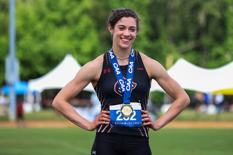 Dominique Beron with a gold medal around her neck.