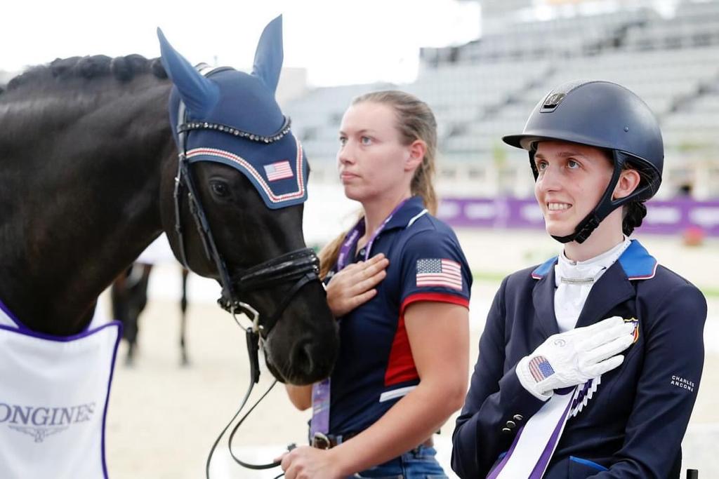 Fiona Howard in front of her horse during the United State's "Pledge of Allegiance".