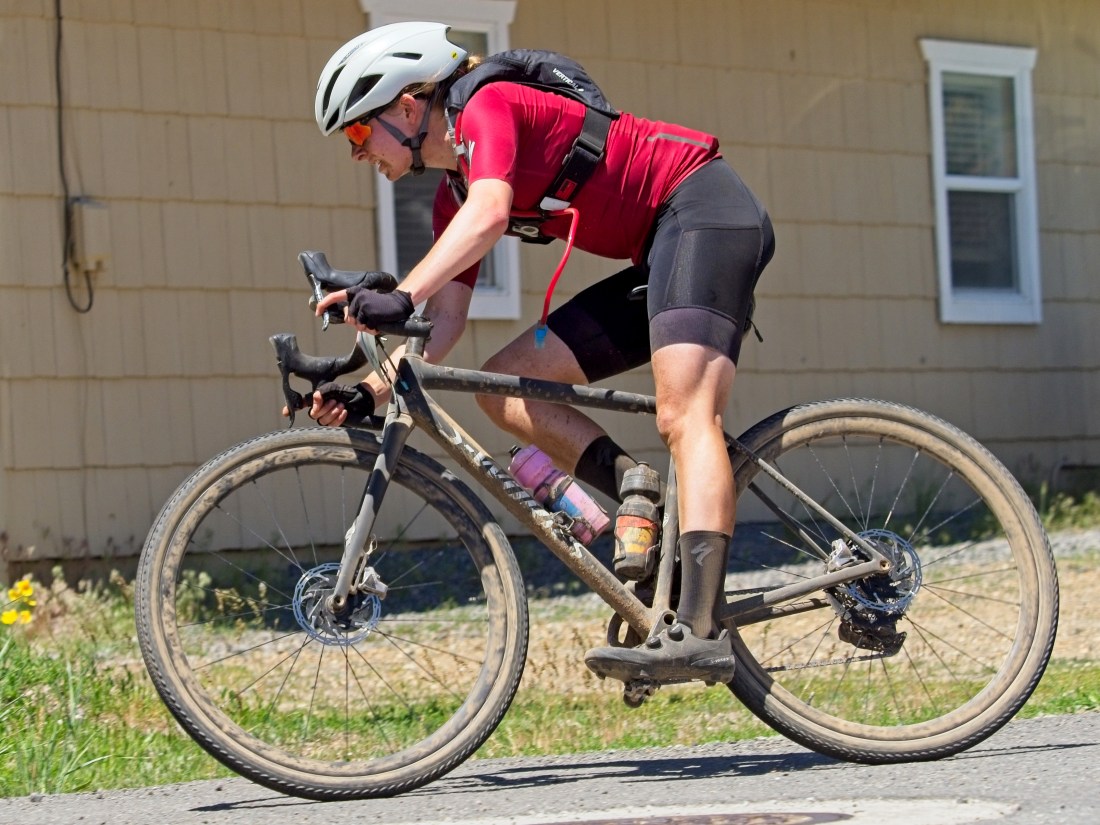 Helena Gilbert-Snyder cycling on the road.