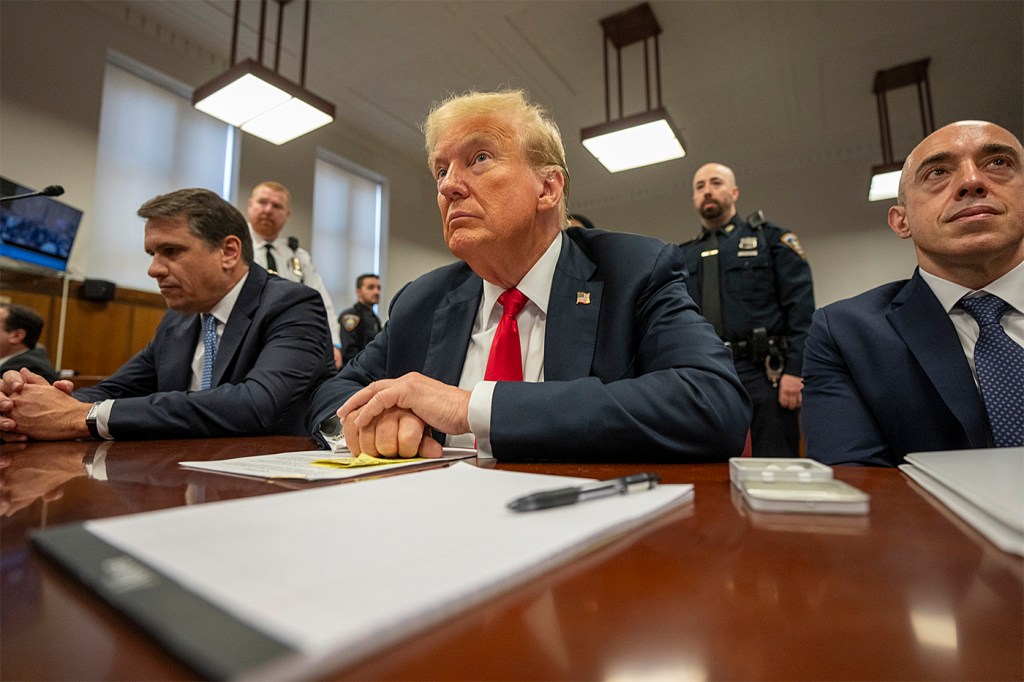 Donald Trump sitting during his criminal trial.