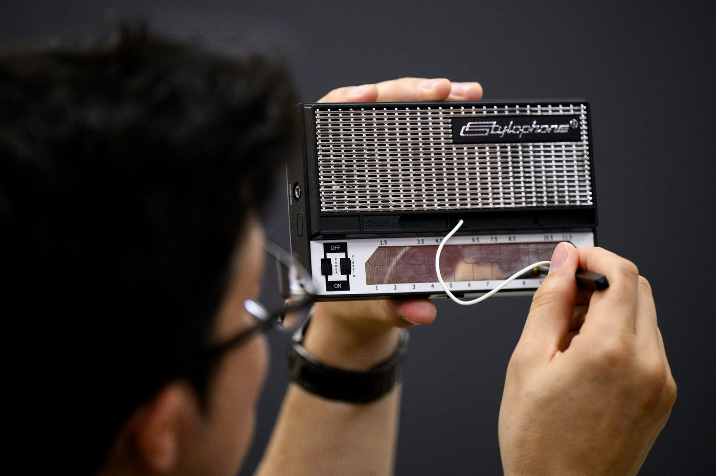 A student using historical musical technology.