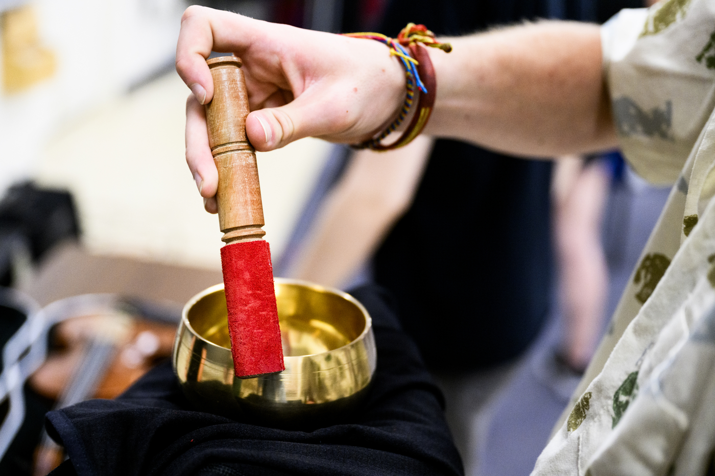 A person holding a historical musical instrument.