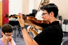 James Guitierrez playing the violin.