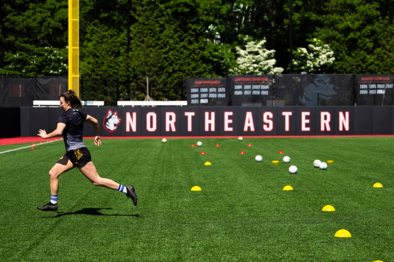 Queen's University Belfast women's gaelic football team practicing on Parsons Field.