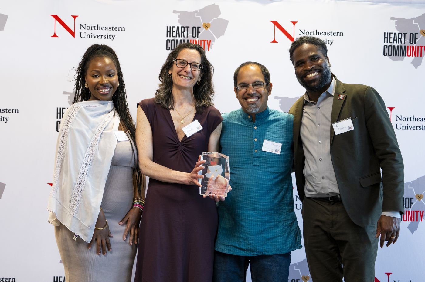 Bilguissa Barry and Chimel Idiokitas posing with two other people at the CommUNITY Awards 2024.