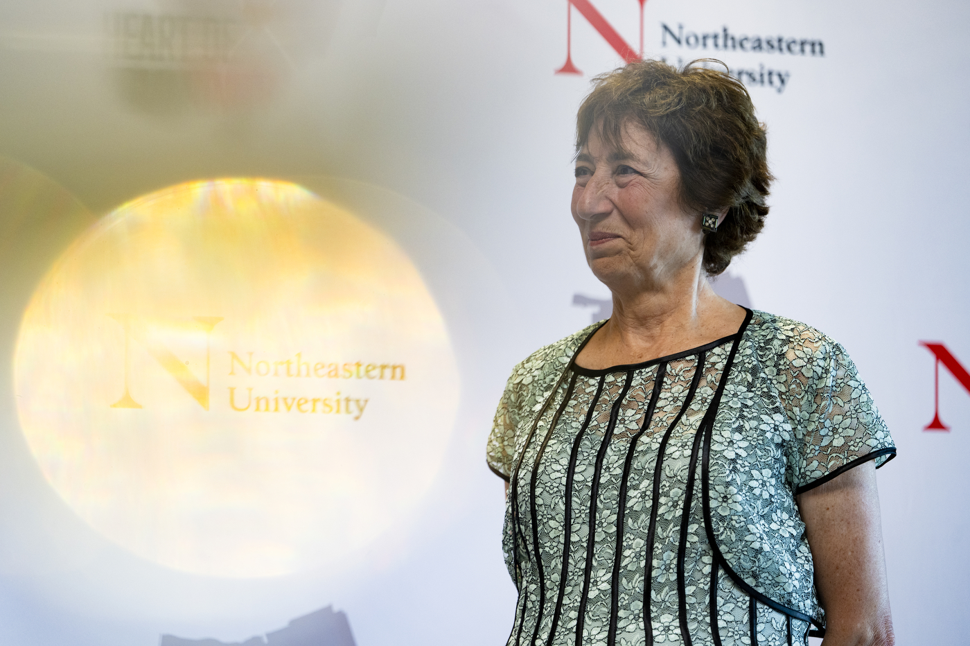 Dolores Boogdanian smiling while being presented an award at the CommUNITY Awards 2024.