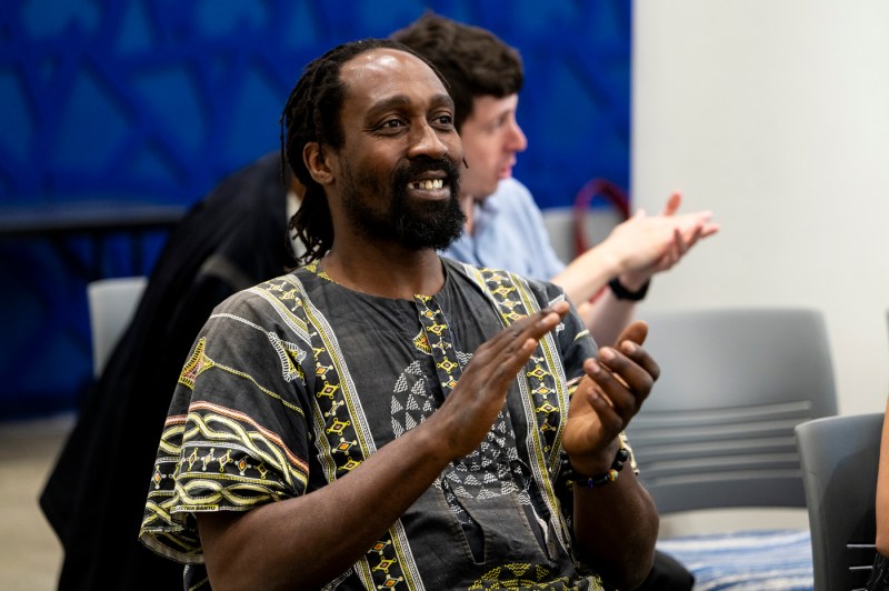 An audience member clapping at Northeastern's 2024 Juneteenth Celebration.