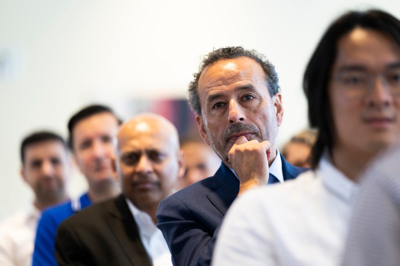 An audience member listening intently at the fireside chest with chess grandmaster Garry Kasparov.