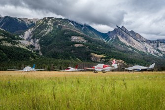 A remote runway in Jasper, Canada in front of mountains.