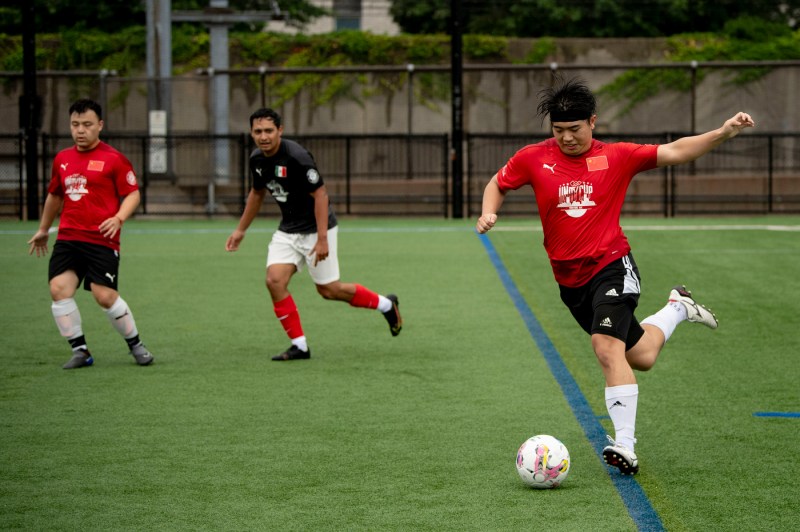 A person playing soccer at the Boston unity cup.