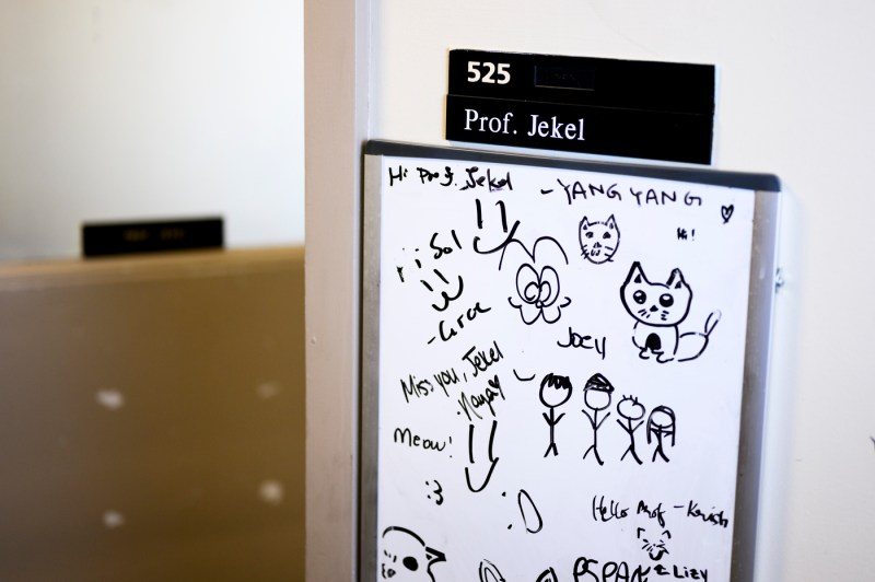 Doodles and drawings on a whiteboard outside of Professor Jekel's office.