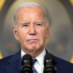 Joe Biden in front of a microphone.