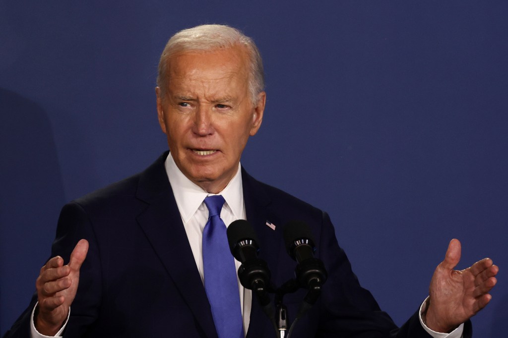 Joe Biden speaking at a podium.