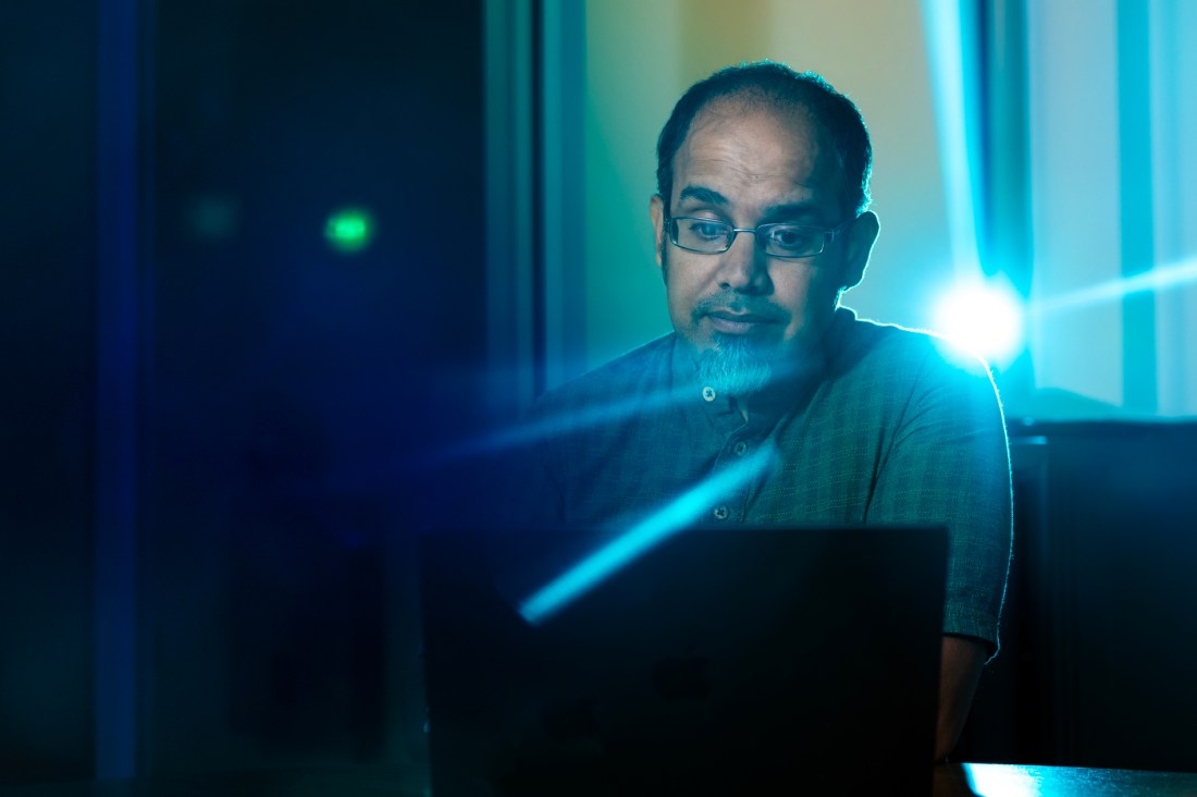 Rahul Bhargava sitting in front of a laptop. 