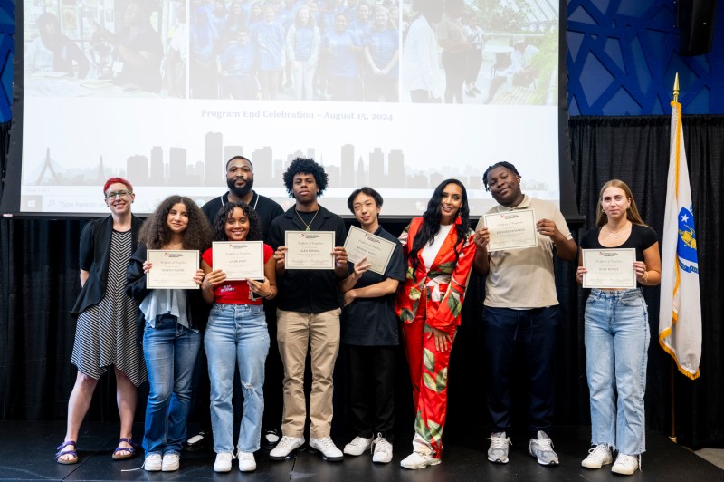 Youth Interns holding awards.