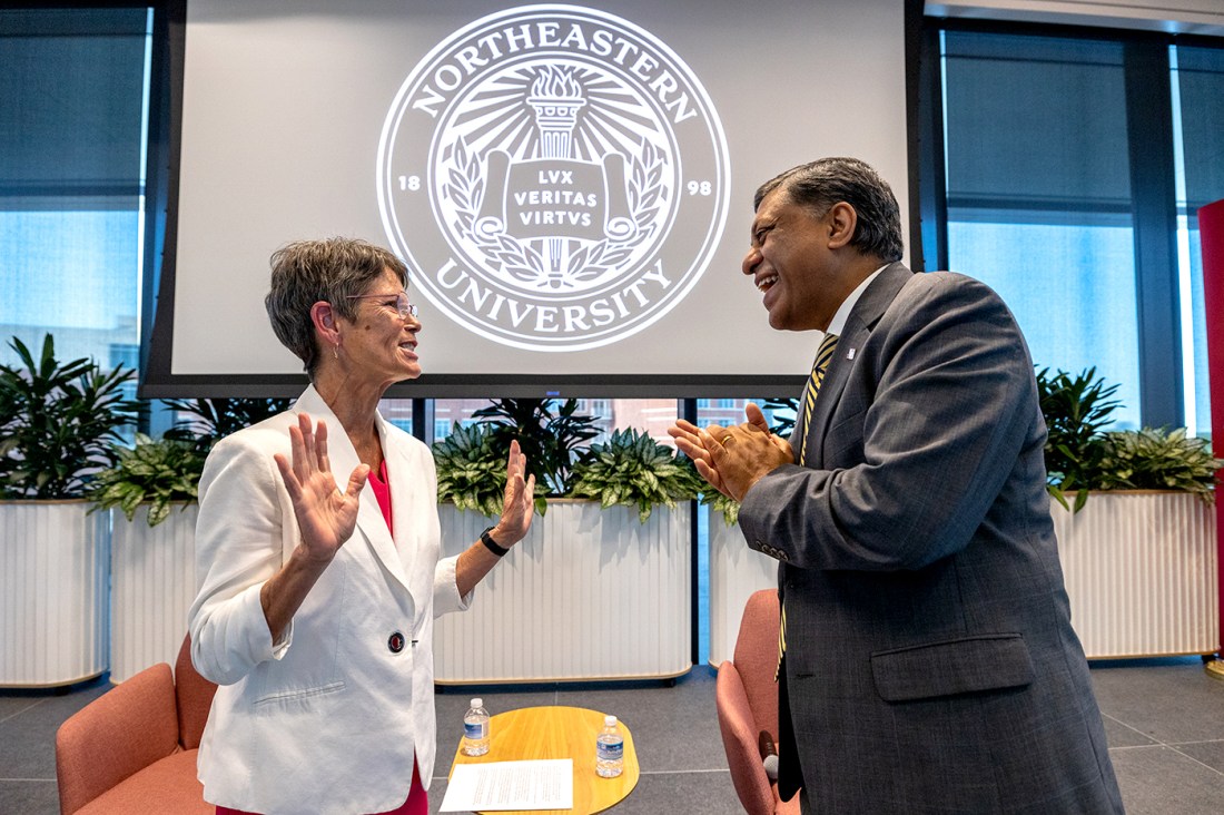 Dr. Rahul Gupta speaking with another person at Northeastern's Charlotte NC campus.