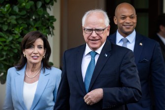 Tim Walz walking next to Kathy Hochul.