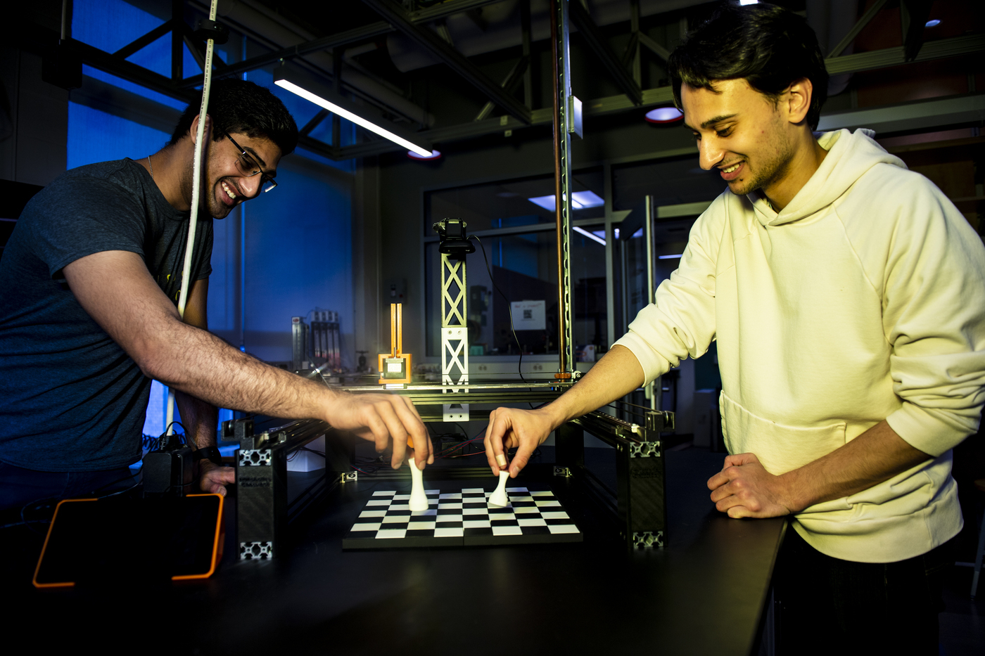 04/26/22 - BOSTON, MA - Northeastern students Sharwin Patil, a computer engineering and computer science major, and Ethan Muhlon, a mechanical engineering major, are working on a chess-playing robot in Richards Hall on Tuesday, April 26, 2022. Photo by Alyssa Stone/Northeastern University