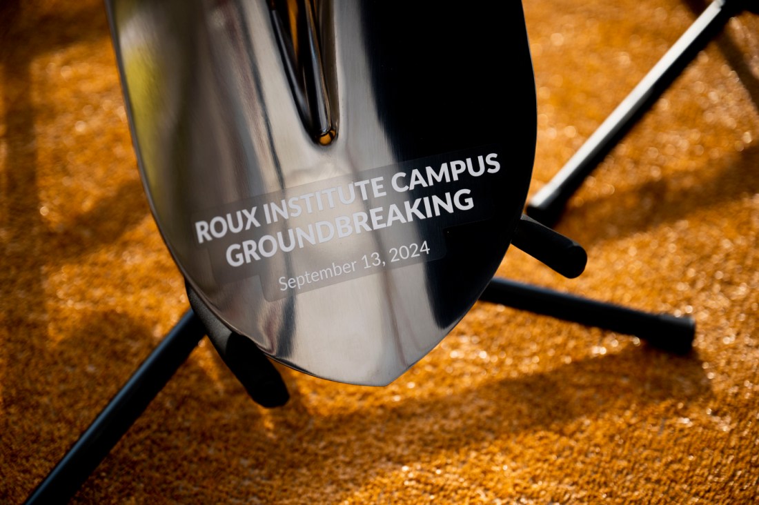 A silver shovel that says 'Roux Institute Campus Groundbreaking September 13, 2024'. 