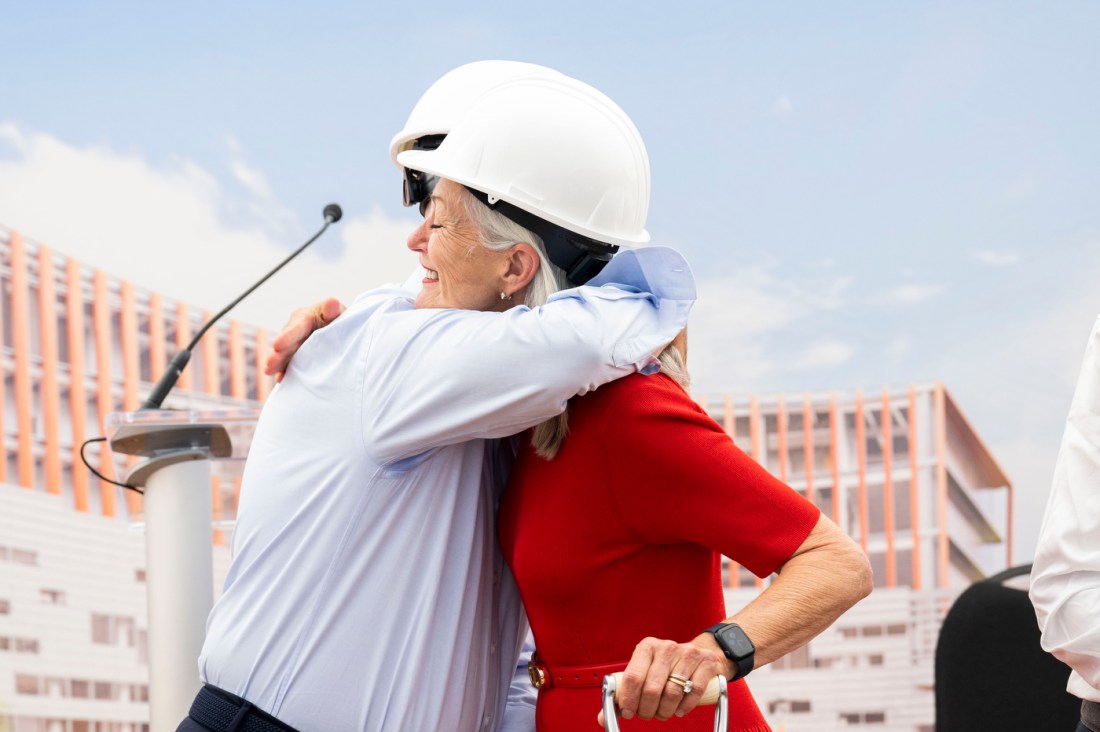 David and Barbara Roux hugging each other. 