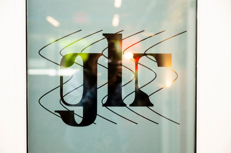 A sticker with the Green Line Records logo on the outside of the door in the Curry Student Center.