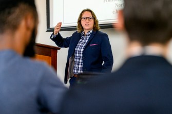 Claudia E. Haupt speaking and gesturing at the Constitution Day Lecture.