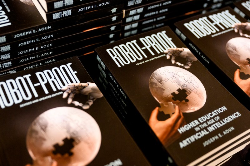 Stacks of copies of President Aoun's book 'Robot-Proof'.