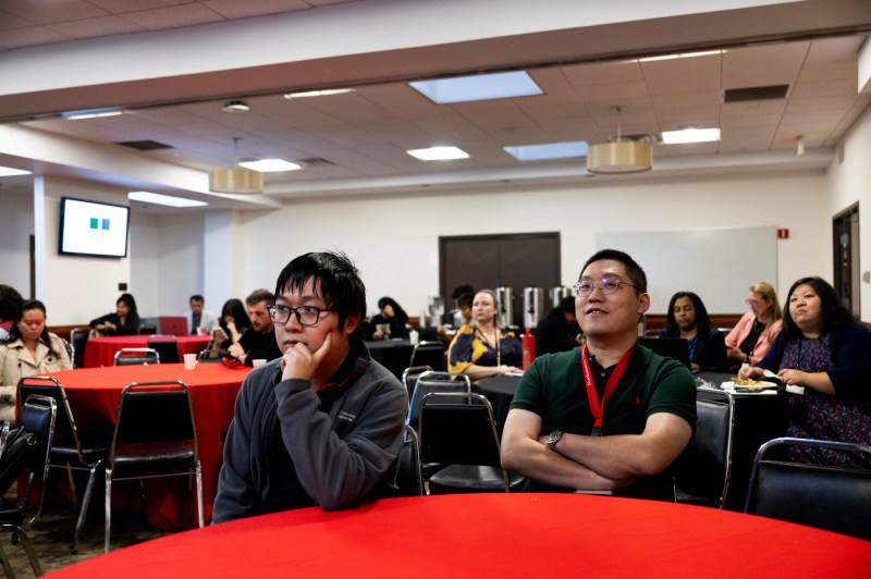 Students listening to Rebecca Carrier speak at a Symposium.