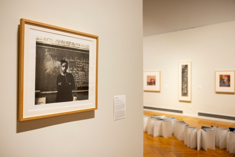 Framed artwork hung on the walls at the Mills College Art Museum.