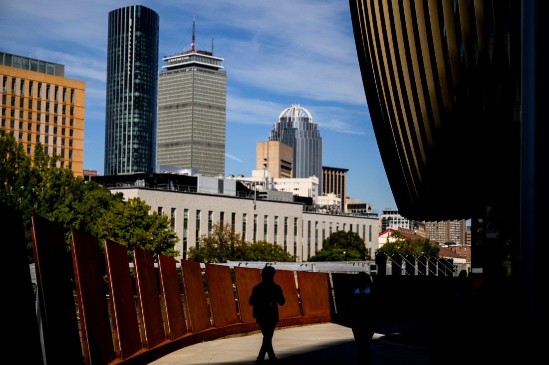 A view of Boston's skyline with the ISEC building and trees in the foreground.