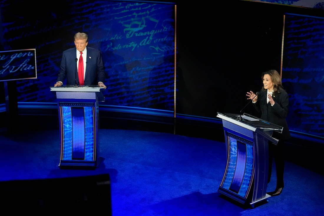 Kamala Harris and Donald Trump standing at podiums for the debate.